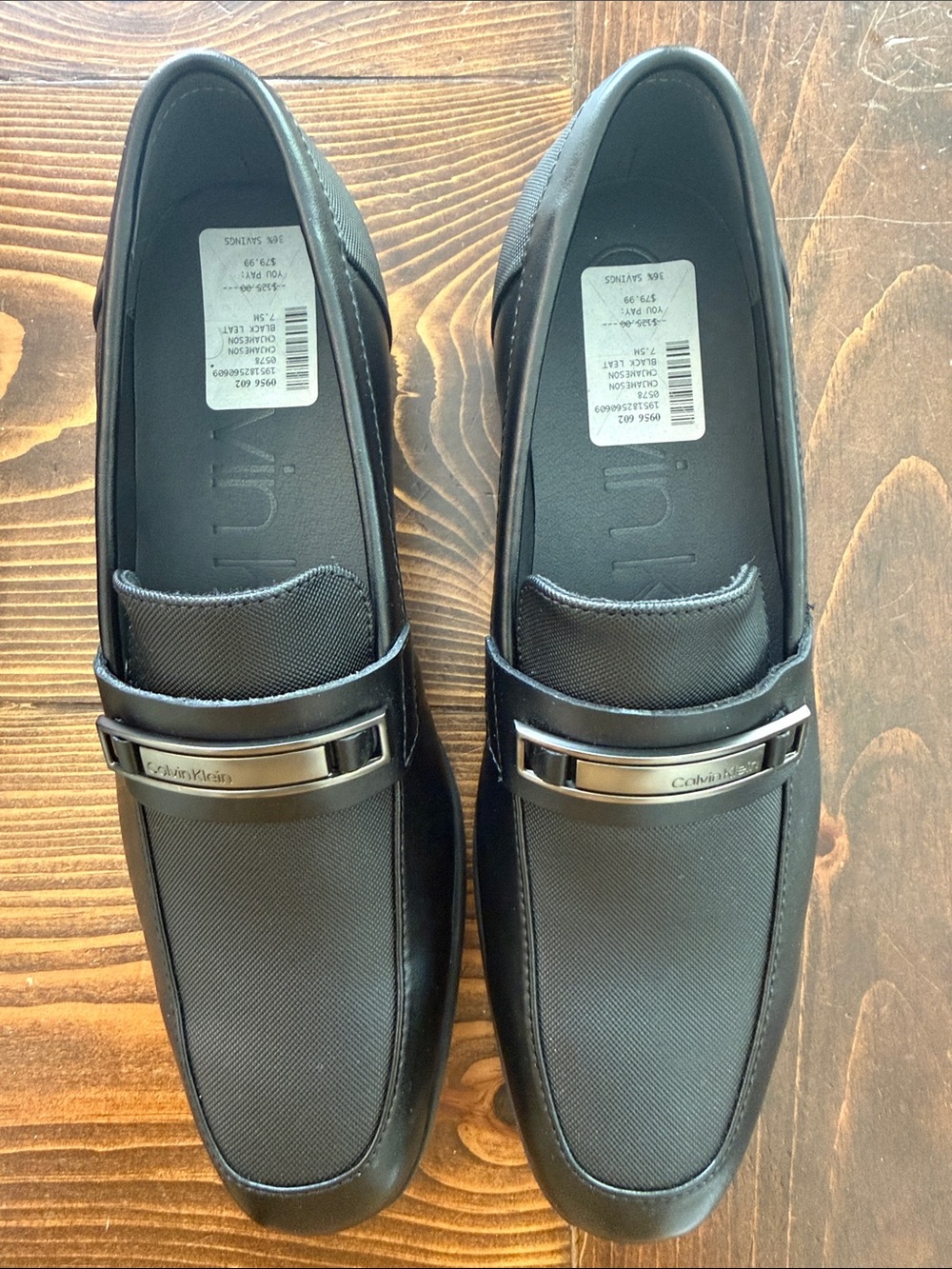 Calvin Klein Men's Black Slip-On Loafers with Silver Accent